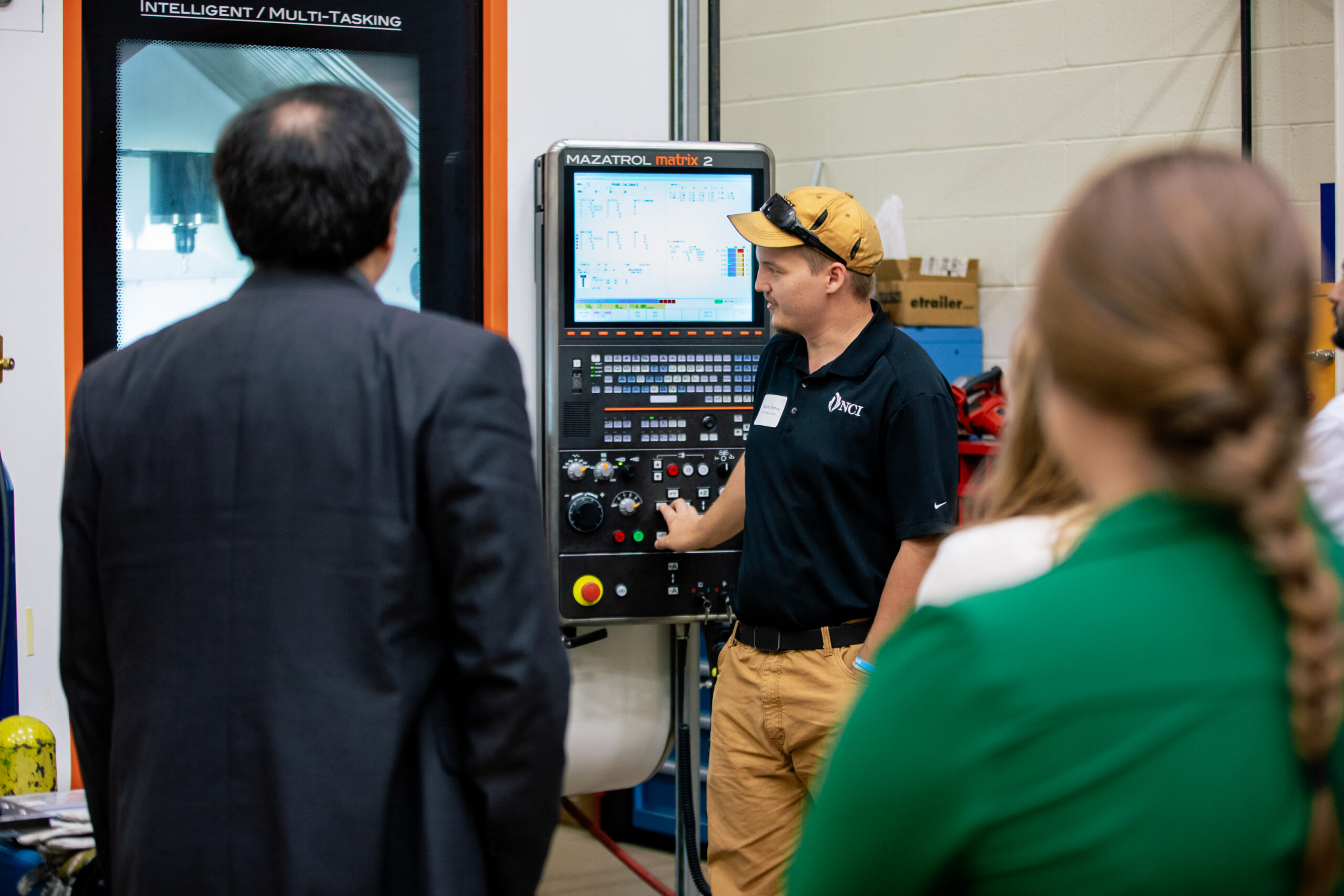 a man leading a VSMA machinery demonstration