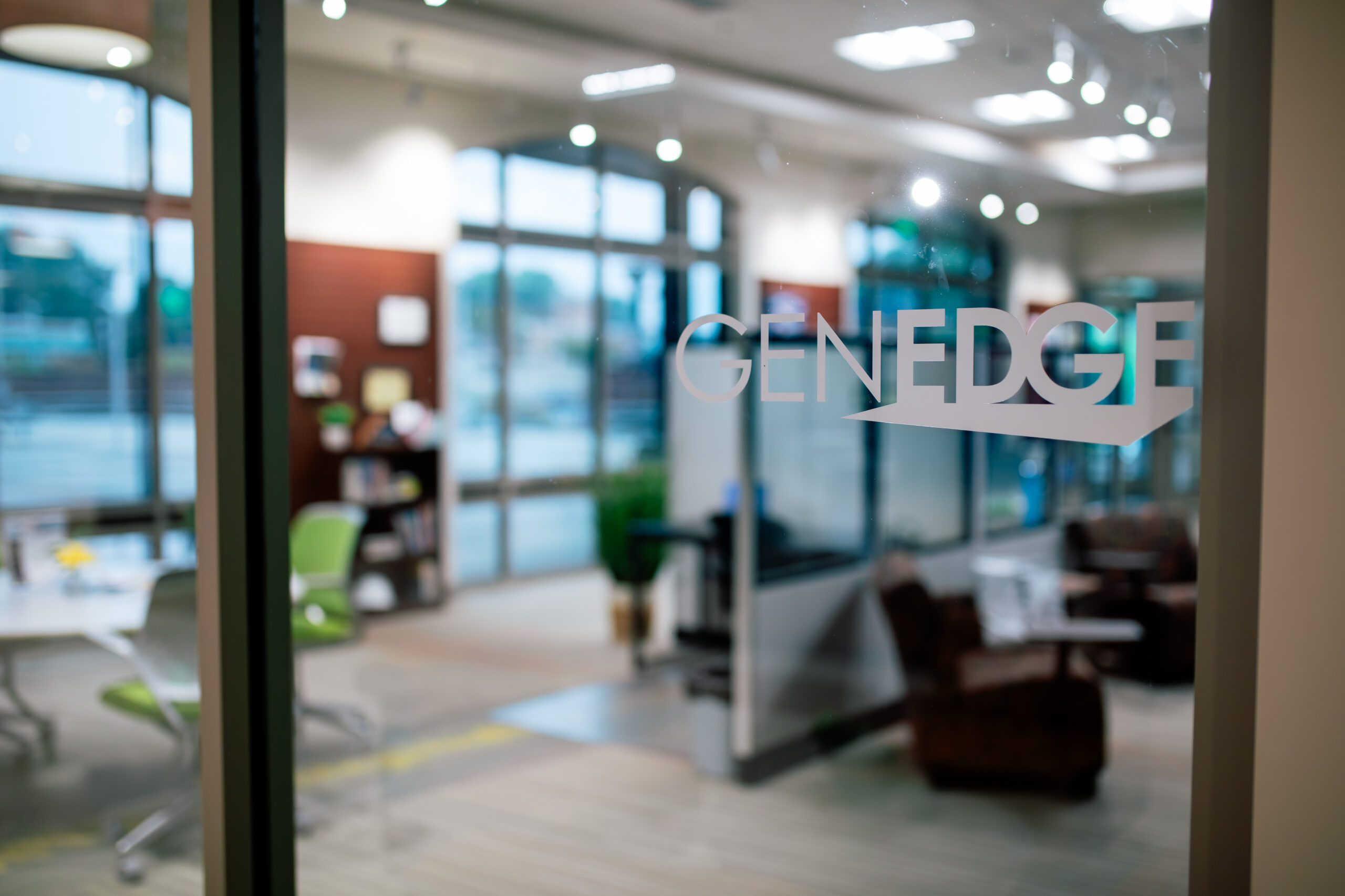 GENEDGE logo on a glass office wall